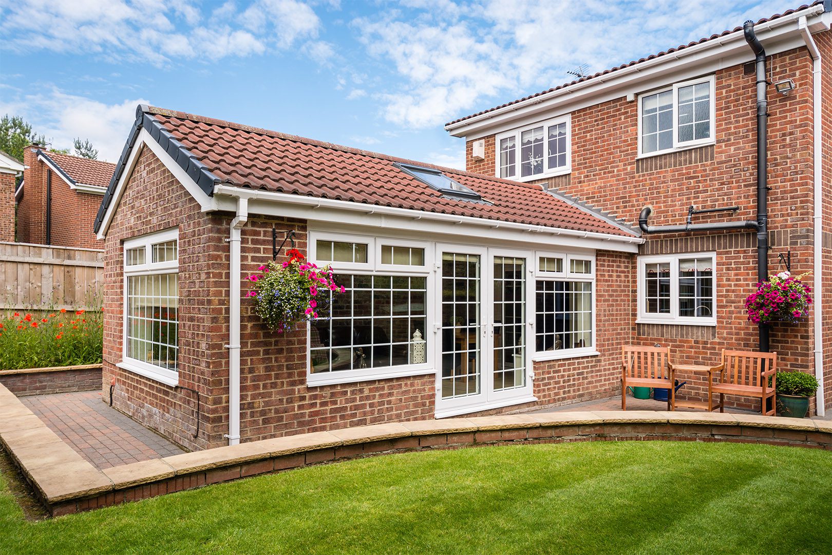 Modern Sunroom or conservatory extending into the garden